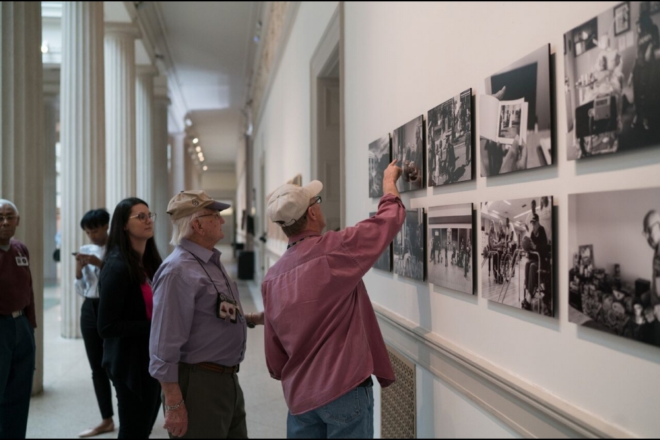 visitors looking at photos