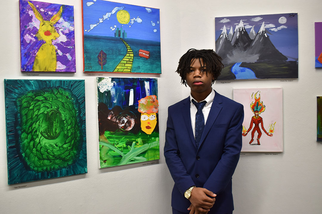 Quinton Burns, a first-year student at Duke Ellington School of the Art at the Gallery 102 exhibition from ArtReach GW. A