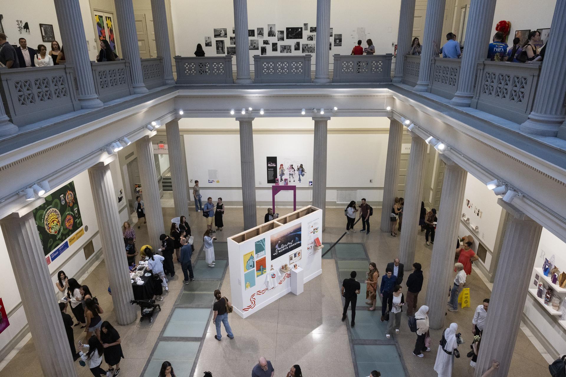 A view from the bridge: Party guests move through the Flagg Building Atrium. (Cara Taylor/GW Today)