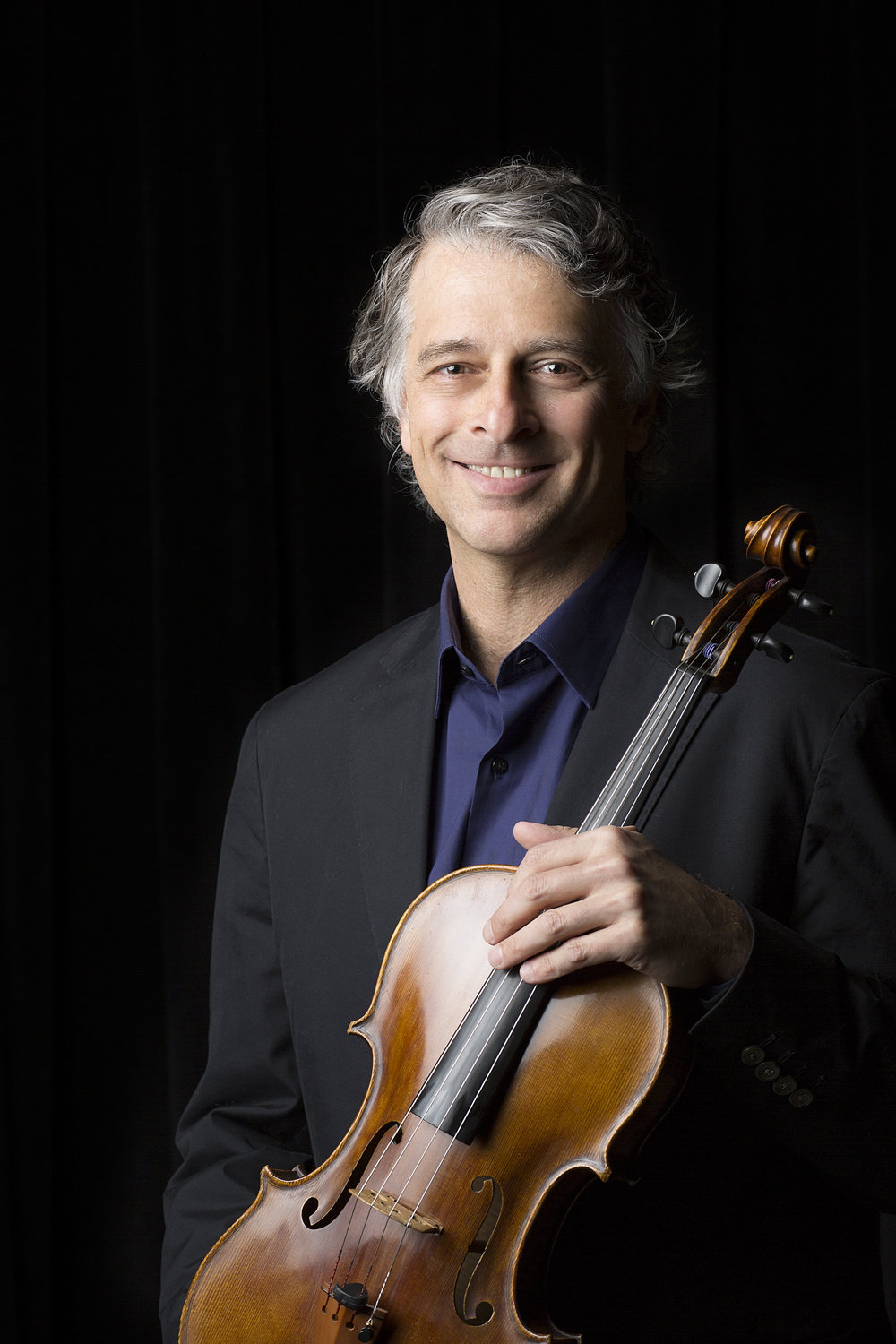 Uri Wassertzug poses with violin