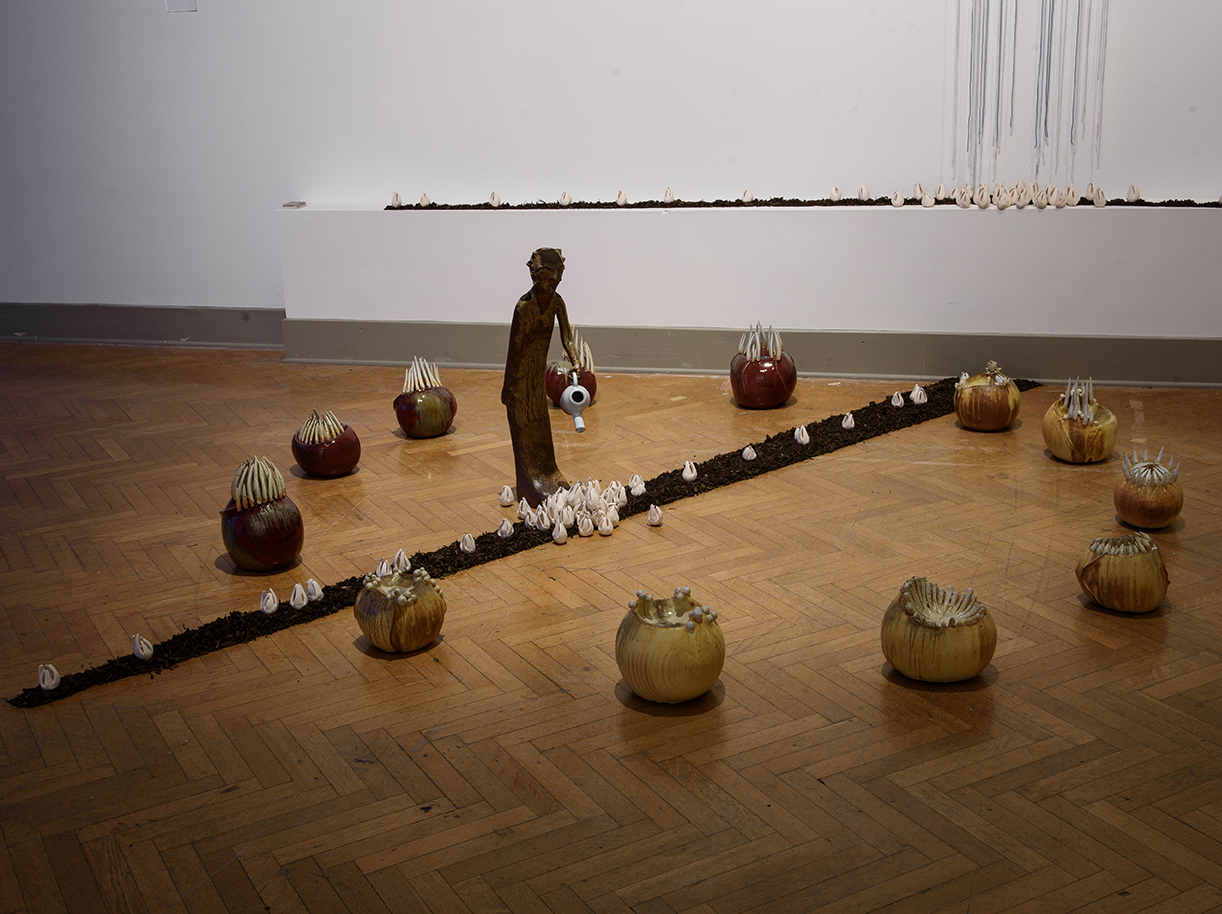 Hadrian Mendoza's "Bloom." Ceramic, Yarn, Dirt. From NEXT 2018