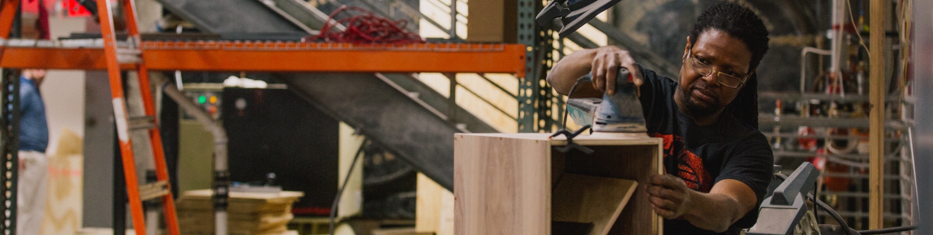 Student sanding wood