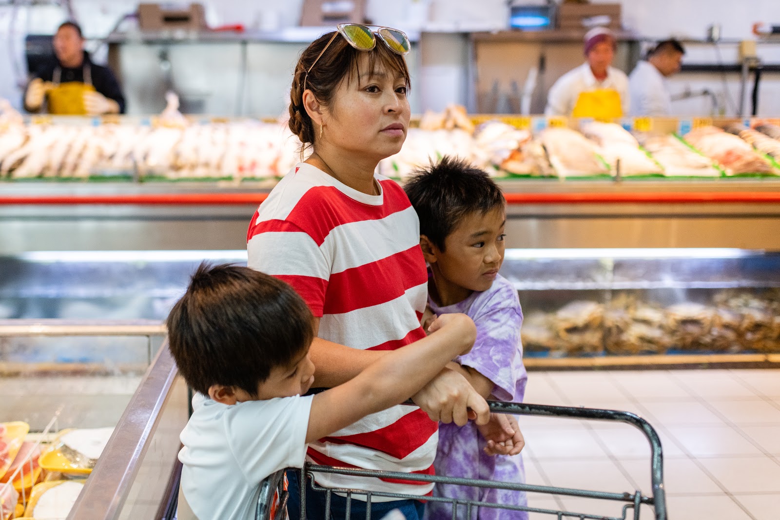 Mother and children in grocery store
