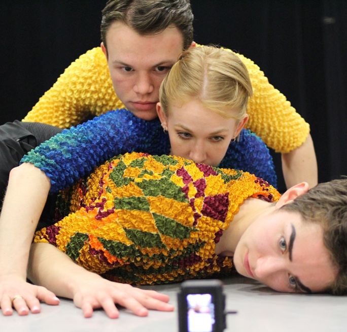 three students performing