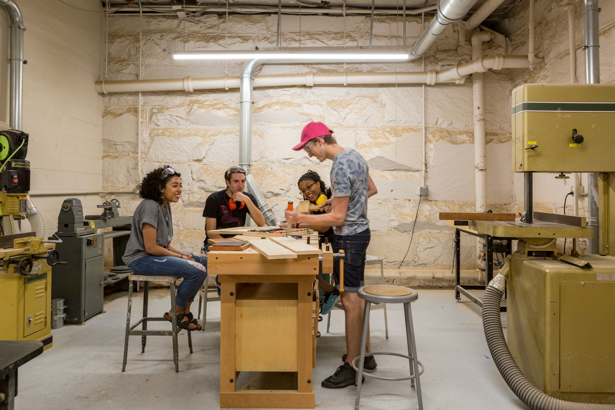 Students working with woodworking tools