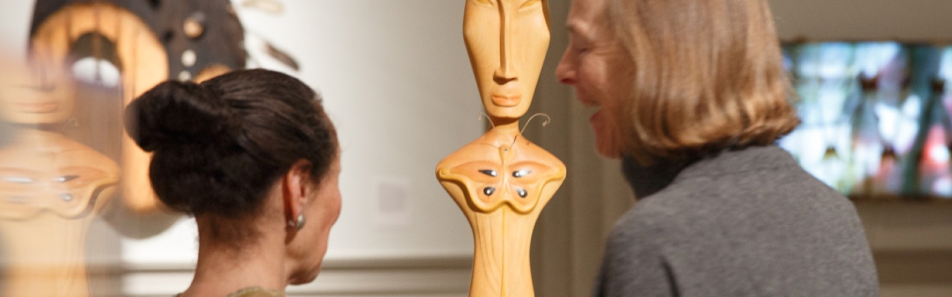 student and professor looking at artwork