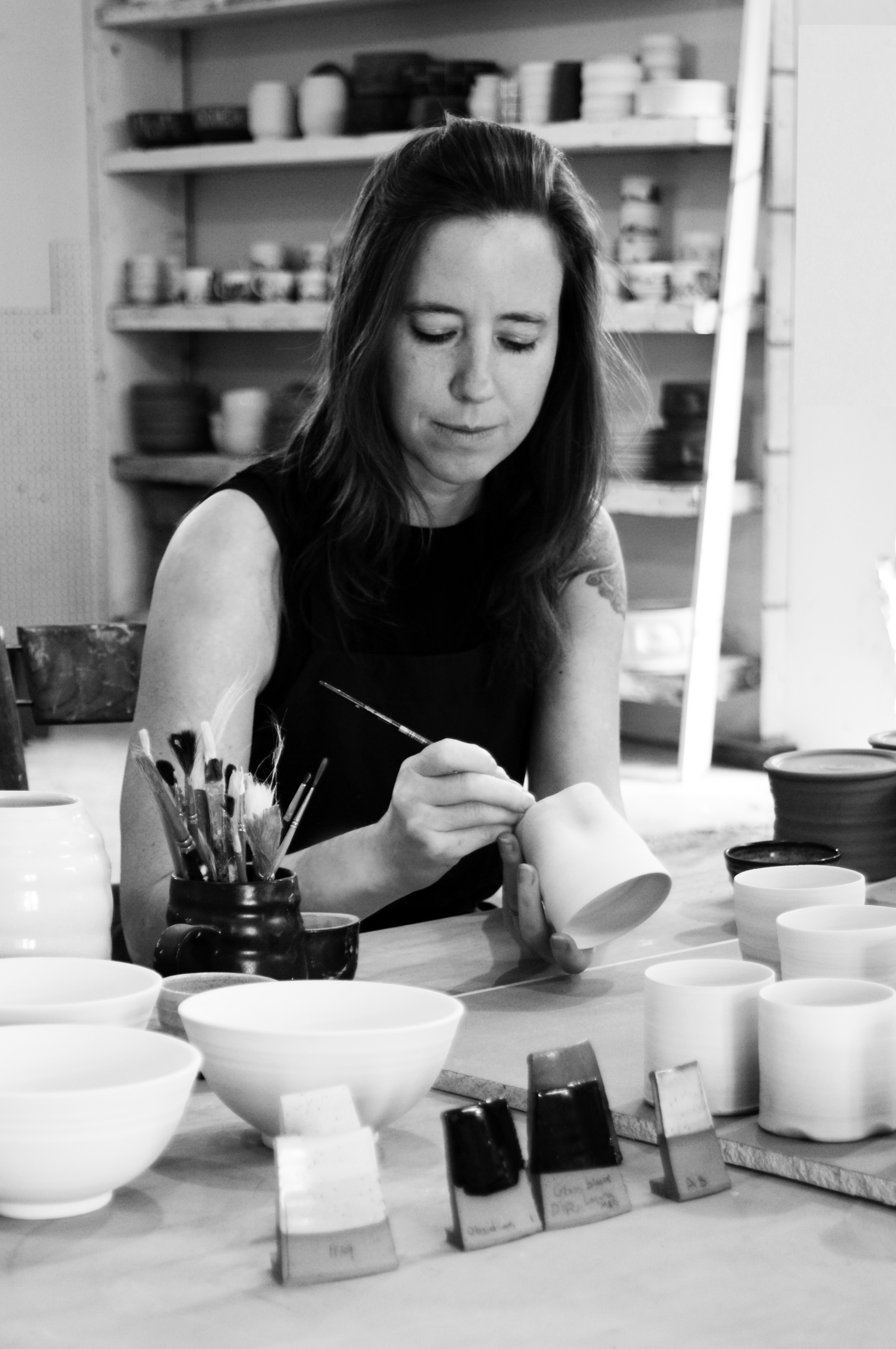 photo of kate hardy working on a ceramics piece