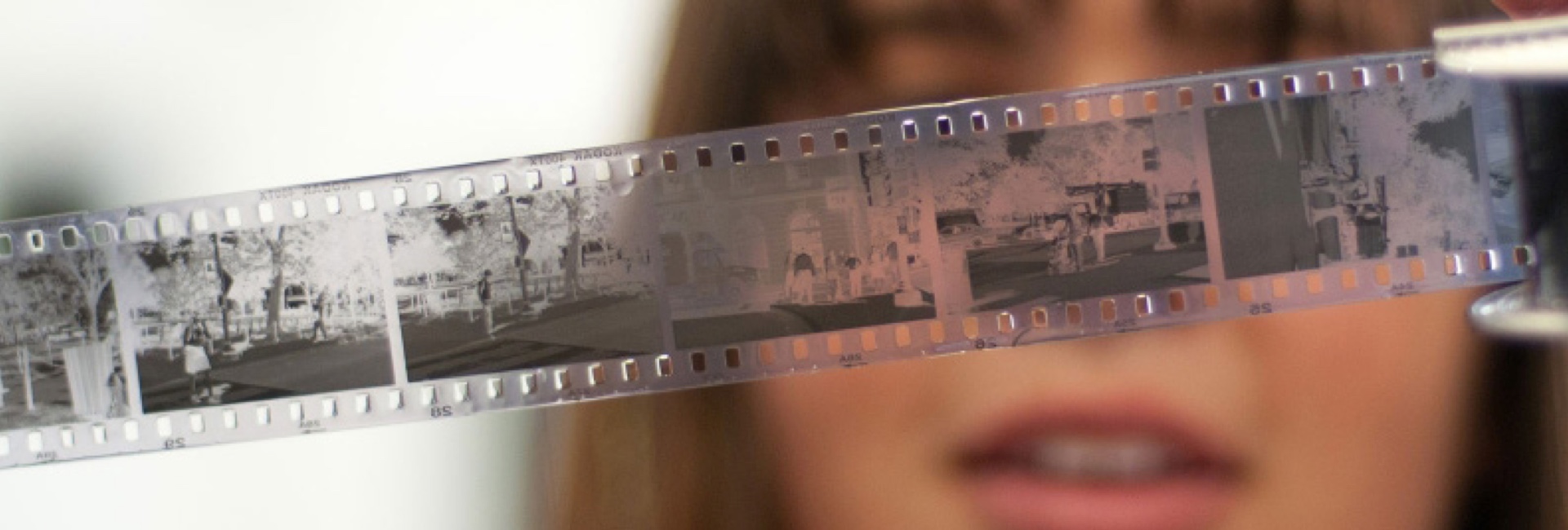 student looking at film