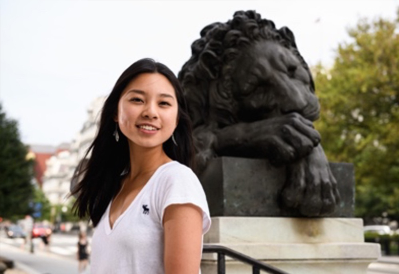 Female student on Corcoran stairs