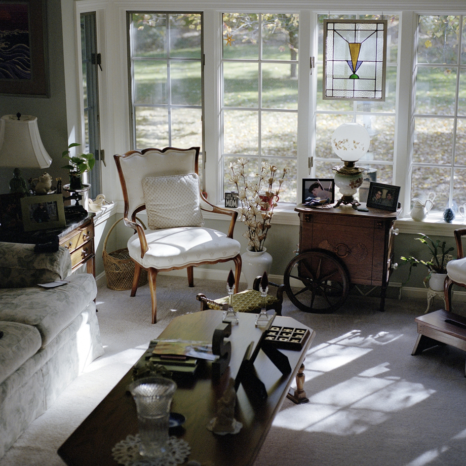 Portrait of a woman with a sparkler and pink trees in the background