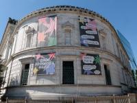Promotional materials for this year's NEXT Festival, including the banners adorning the Flagg Building, were designed by students. (William Atkins/GW Today)