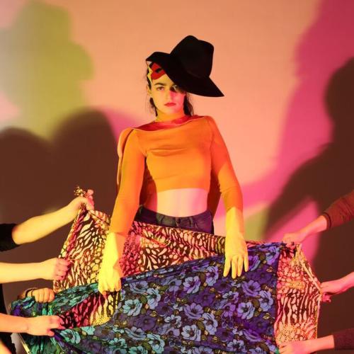 student in high fashion posing on steps 