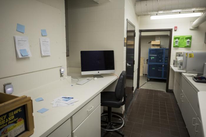 A computer monitor sits on a desk
