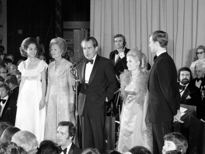 Newly inaugurated President Richard M. Nixon at what is now the National Museum of American History, with Patricia Nixon, Julie Nixon Eisenhower, Tricia Nixon Cox and Edward F. Cox on Jan. 20, 1973. (Richard Hofmeister/Smithsonian Institution Archives)