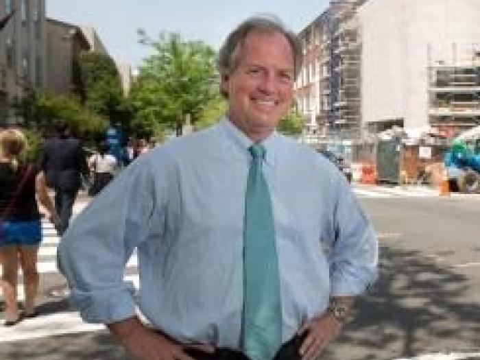 photo of john wetenhall standing at a street intersection