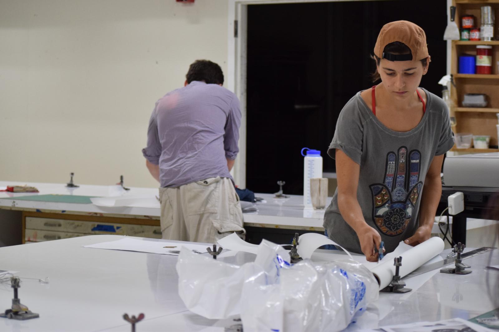 Student working on screenprinting table