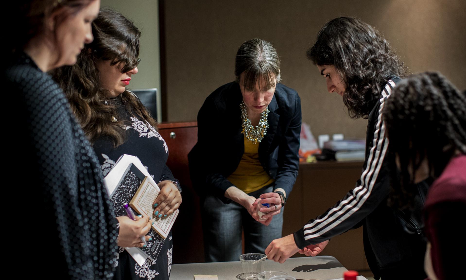 People work on an art project