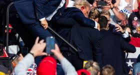 GW alumnus Eric Lee, while working for the New York Times, took this photo of former President Donald Trump leaving the stage after being shot at a rally on July 13 in Butler, Pa. (Eric Lee/The New York Times/Redux)
