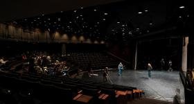 The tech crew cleans and prepares the stage prior to dance rehearsal in the Dorothy Betts Marvin Theatre